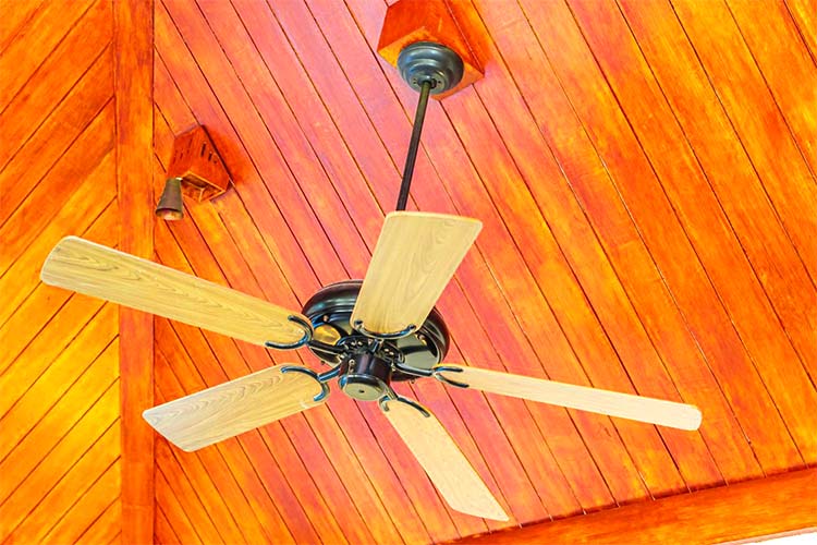 A wooden ceiling fan