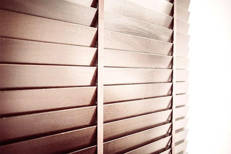 A wooden window blinds