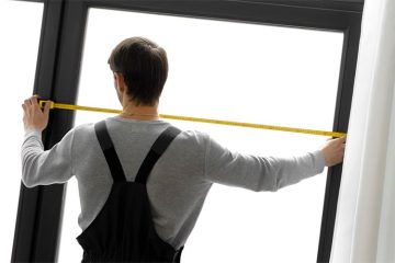 A man shows how to measure storm door