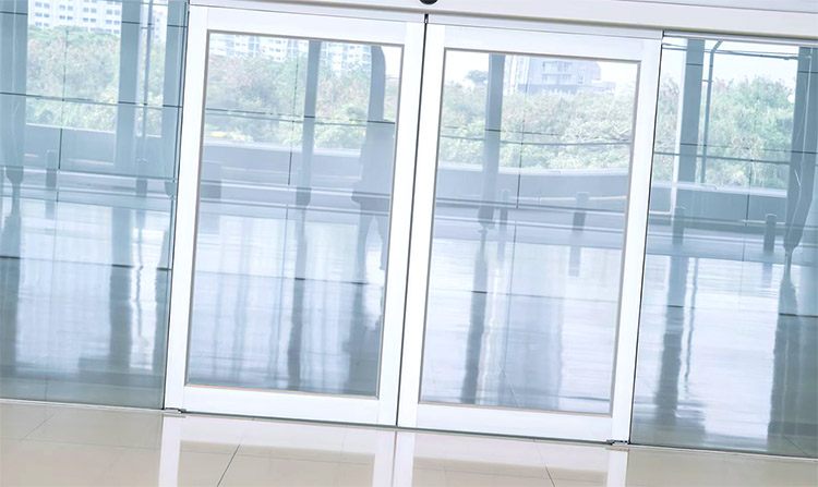 A middle shot of a glass white bifold doors 